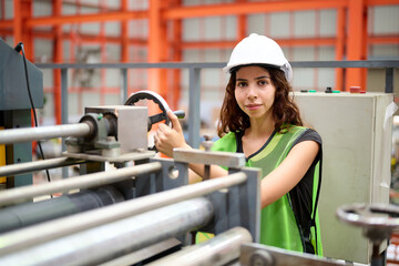 Engineer or worker checking machine control in the factory