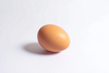 a single egg on a white surface