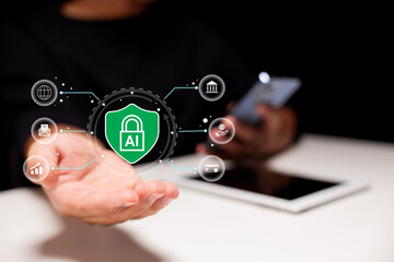 A digital hand holds a floating AI security icon, symbolizing artificial intelligence data...