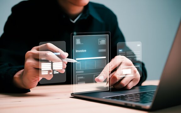 Person interacting with holographic invoice interface on laptop digital technology