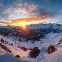 Breathtaking sunset over snowy mountain landscape.