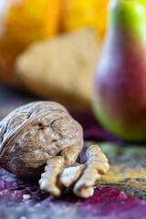Open walnut with its fruit in an autumnal setting