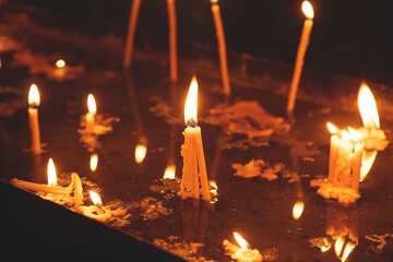 Burning candles in a church.