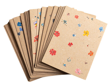 Stack of natural biodegradable seed paper cards with floral design, isolated on a transparent background - Powered by Adobe