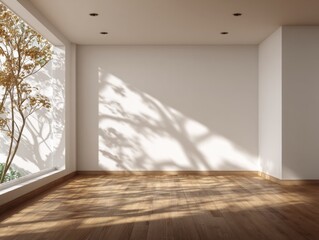 A large empty room with a window and a tree outside. The room is mostly white with a few brown accents