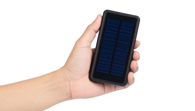 Hand holding solar-powered portable charger with LED indicator, isolated on a transparent background