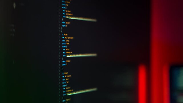 Programming code screen closeup data technology concept. Focused view of a computer monitor displaying structured code with syntax highlighting