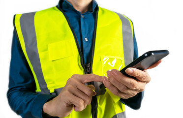 Engineer holding mobile phone to view work data and check work