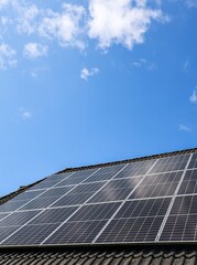 Photovoltaic panels providing clean energy on a rooftop under blue sky
