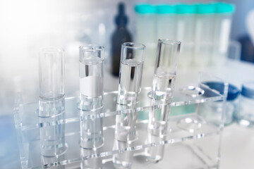 Clear bottles and dishes are used in scientific and medical experiments.