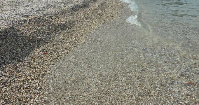 Tranquil Pebble Shore of Clear Lake &ndash; Vertical Video