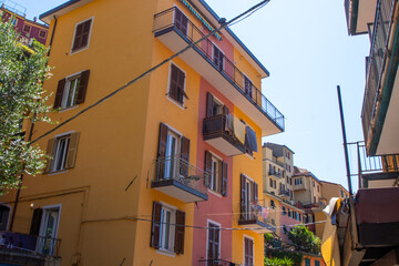 Yellow home. Colorful houses buildings Manarola Italian narrow empty street architecture, Liguria bright window with shutter. Italy Cinque Terre