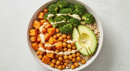 Vibrant Vegan Bowl: Roasted Sweet Potato, Broccoli, Chickpeas, Avocado, and Buckwheat with Creamy Drizzle