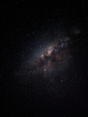 A breathtaking display of stars illuminates the night sky, showcasing the Milky Way in a peaceful and remote setting