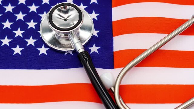 Professional Medical Stethoscope on the Vibrant American Flag - A Symbol of the Nation&rsquo;s Healthcare System and Medical Professionals