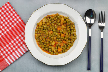 Green Peas with vegetables and herbs. Vegetarian dinner