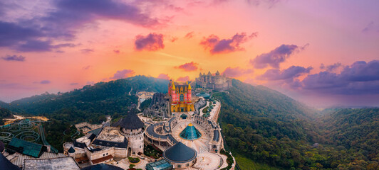 Naklejka na ściany i meble Scenic panoramic view of castles and French village ba na hills at sunset in Da Nang, landmark of Vietnam