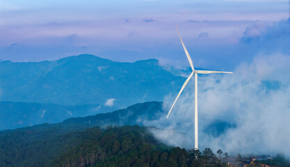 Wind generator amidst misty mountains in Da lat, Vietnam