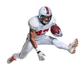American football athlete in air jumping pose while holding a ball
