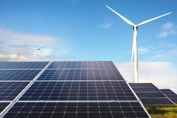 Solar panels and wind turbine outdoors. Alternative energy source