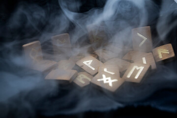 thick smoke descends on the wooden runes	
