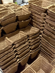 Stacked eco-friendly seedling trays ready for planting in the garden