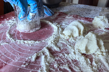 Preparing dough with care in a rustic kitchen for a delightful recipe