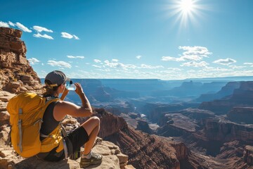A hiker enjoys a scenic vista of a grand canyon.