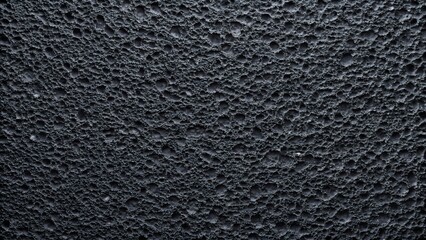 Abstract dark textured surface with a complex organic pattern and subtle lighting