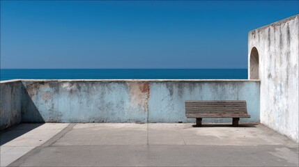 Coastal overlook with a weathered bench.  A serene, minimalist view of a  light blue-gray wall,  a wooden bench, and a vast expanse of ocean against a clear blue sky