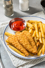 Deep Fried Tender Chicken Fingers and French Fries