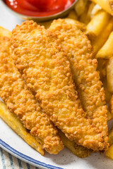 Deep Fried Tender Chicken Fingers and French Fries