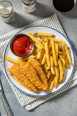Deep Fried Tender Chicken Fingers and French Fries