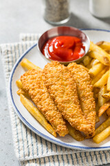 Deep Fried Tender Chicken Fingers and French Fries