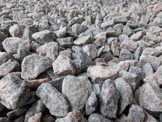 Natural gravel carpet covers the ground with smooth stones under soft daylight in a tranquil outdoor setting