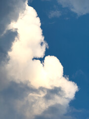 Billowing cumulus cloud and blue sky