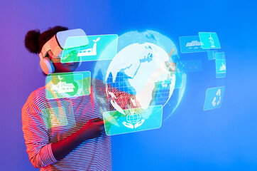 A young individual engages with virtual reality, exploring sustainable technologies and...