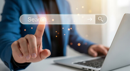 Fototapeta premium Man using laptop and touching a search bar on a digital interface, representing online search and information discovery
