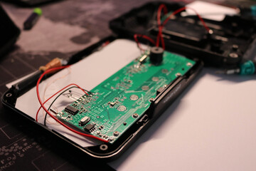 Electronic Circuit with Red Wires and Tools