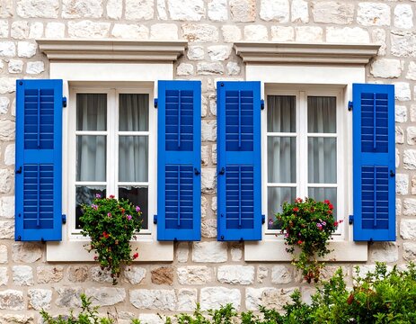Two windows with blue shutters and flower boxes (1) - Powered by Adobe
