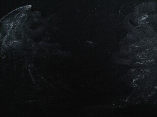 Black dirty dust and scratches overlay. Black grunge abstract background. Rough background texture. Old film effect with scratched texture. Copy space.