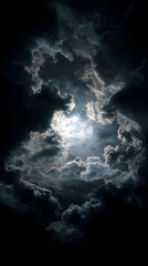 Fototapeta premium A dramatic sky filled with dark clouds and a bright light source shining through the clouds above