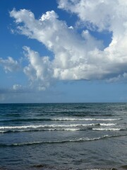 Dramatic sky clouds over ocean 