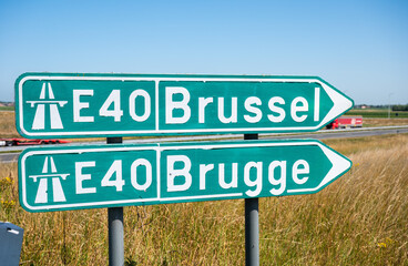 Road sign to the E 40 highway to Brussels and Bruges in Avekapelle, Veurne, Belgium