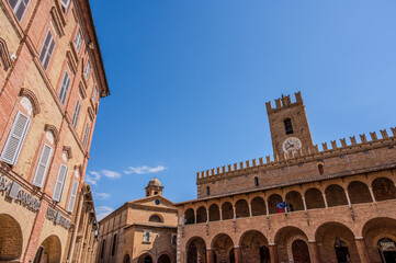 Fototapeta premium Offida. Town Hall. Built between the 13th and 14th centuries (central crenellated tower). The façade is preceded by a 7-arched portico with an elegant 14-arched loggia raised in the 15th century.