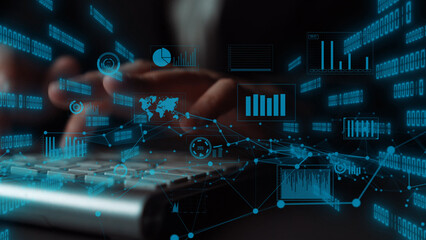 A close-up view of hands typing on a keyboard with a digital overlay of charts and graphs,...