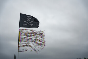 Pirate Flag with Colorful Streamers in the Wind at flensburg harbor