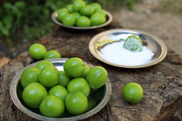 Fresh Green Plums with Salt on Metal Plates