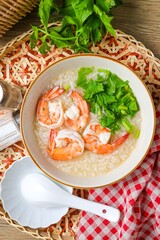 Rice porridge with shrimp ,home made rice soup with shrimp in a ceramic bowl
