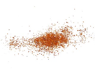 Spicy dried red chili pepper powder. Splashes of red pepper powder. A pile of crushed chilies or...